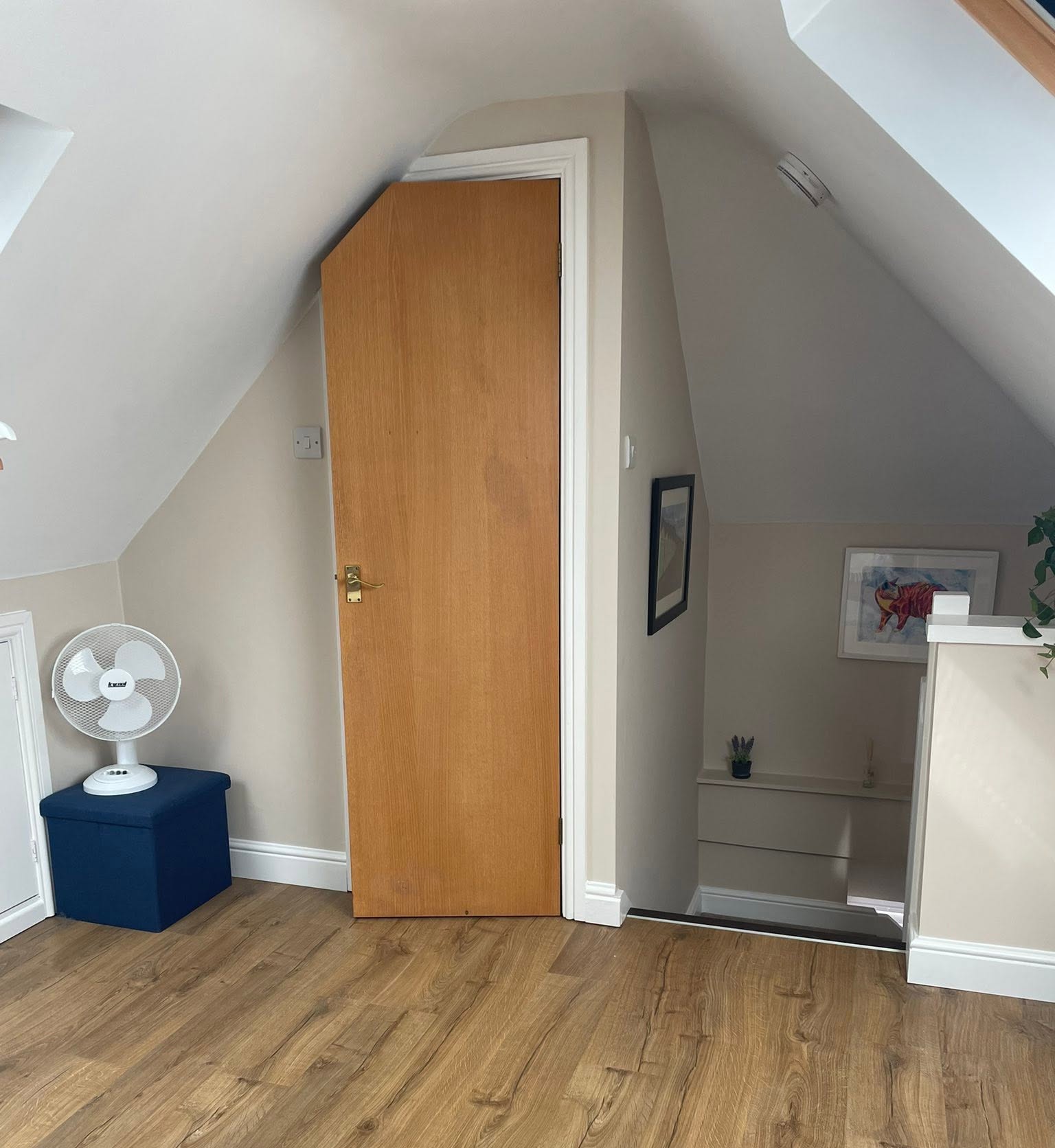 The bedroom upstairs, looking towards the window