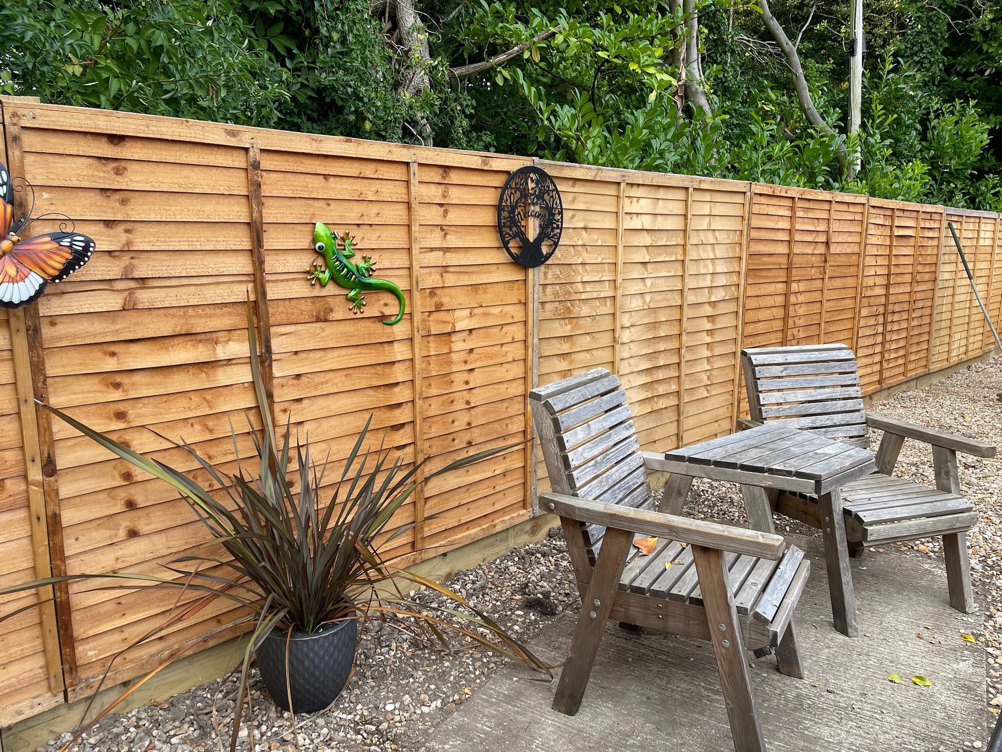 The seating area and the annexe seen from the garden