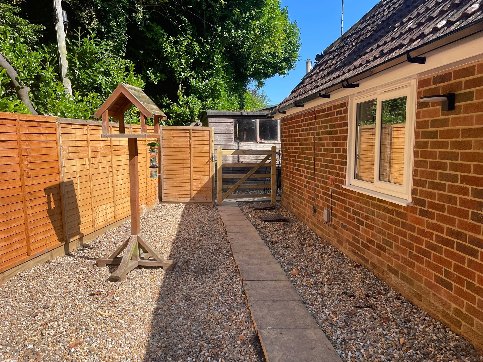 The seating area and the annexe seen from the garden
